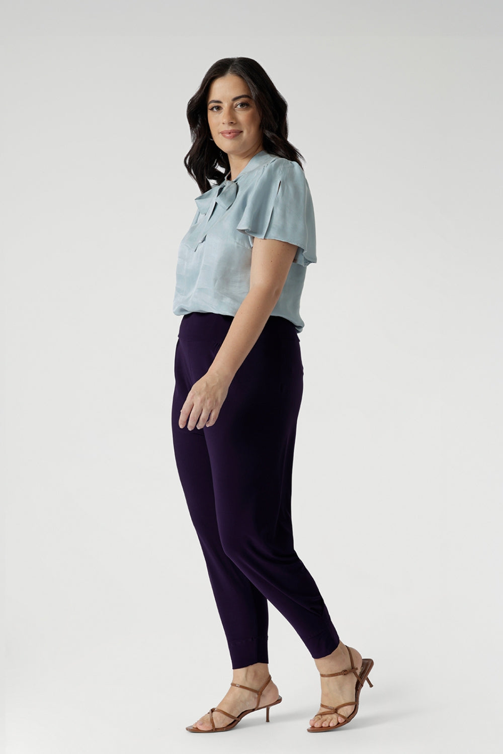 A good pant for petite women, the Indi Pant in Amethyst is worn with an oversized, 3/4 sleeve blouse. A pull-on pant in stretch jersey, these cropped length trousers make comfortable travel pants. Made in Australia by Australian and New Zealand womens clothes brand, Leina & Fleur, shop their pants in petite to plus sizes.