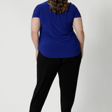 Back view of pants for travel, these dropped crotch, cropped leg, single seam black pants, shown in a size 18, are made stretchy jersey for ultimate comfort. Australian made by Australian and New Zealand women's clothing brand, L&F shop these comfy navy pants for your travel and capsule wardrobe now!