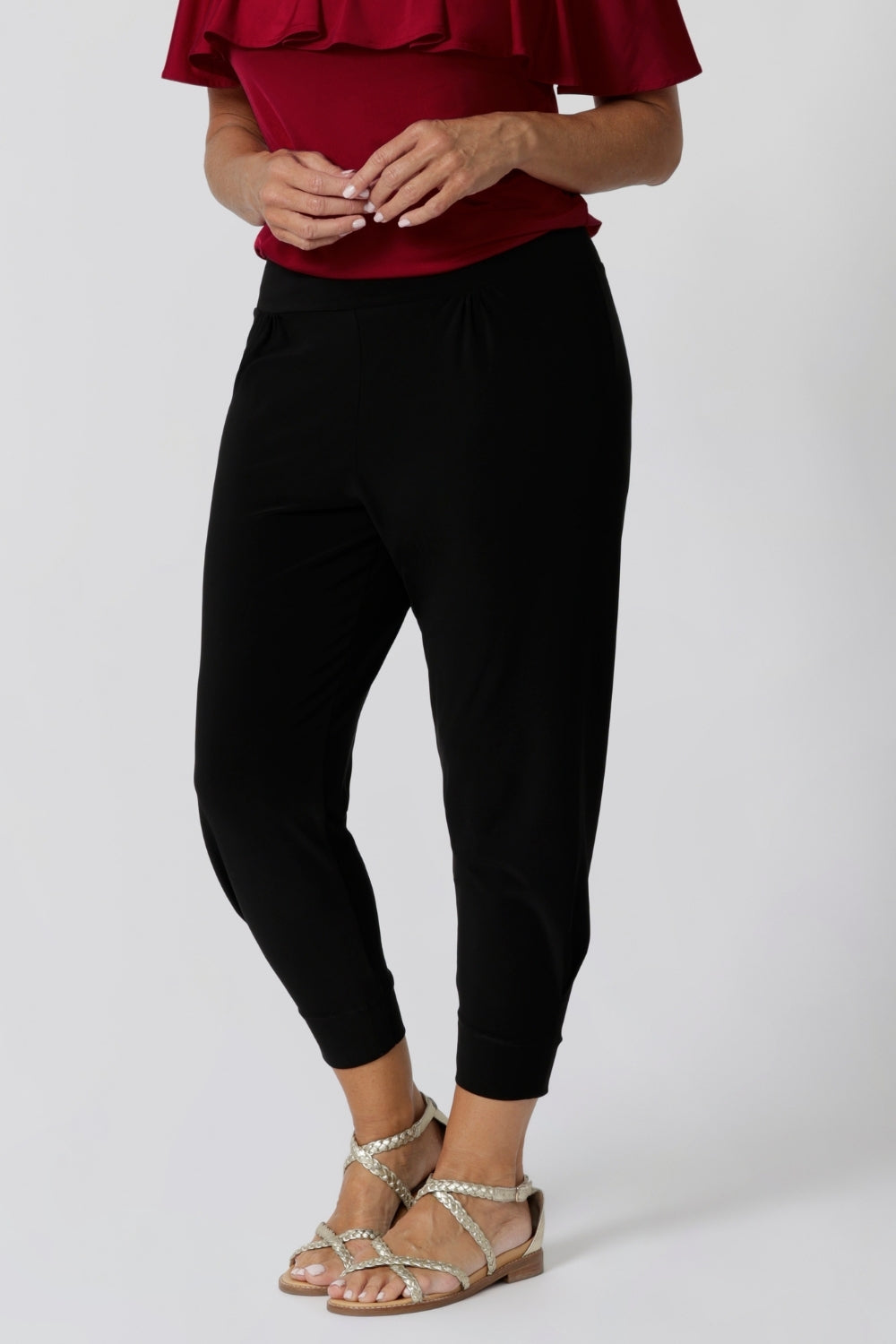 Great pants for travel, these dropped crotch, cropped leg, single seam black pants are made stretchy jersey for ultimate comfort. Worn with white bamboo jersey top , shop these comfy navy pants for your travel and capsule wardrobe now!