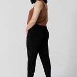 Back view of pants for travel, these dropped crotch, cropped leg pants are shown in a size 10. Made from stretchy jersey for ultimate comfort. Australian made by Australian and New Zealand women's clothing brand Leina & Fleur. Now available in sizes 8-24, in both plains colours and prints.