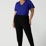 Great pants for travel, these dropped crotch, cropped leg, single seam black pants are made stretchy jersey for ultimate comfort. Worn with cobalt bamboo jersey top , shop these comfy navy pants for your travel and capsule wardrobe now!