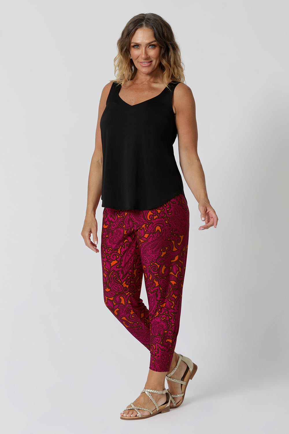 Over 40 woman wears travel pants made for ultimate comfort and style for your next adventure. Crafted in vibrant paisley print, they offer a fun and chic design that stands out while still being versatile. Made with soft touch jersey fabric they will keep you comfortable throughout long flights or sunny sightseeing days. Stocked in sizes 8-24 at leinaandfleur.com.au