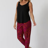 Over 40 woman wears travel pants made for ultimate comfort and style for your next adventure. Crafted in vibrant paisley print, they offer a fun and chic design that stands out while still being versatile. Made with soft touch jersey fabric they will keep you comfortable throughout long flights or sunny sightseeing days. Stocked in sizes 8-24 at leinaandfleur.com.au