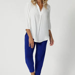 In a brightly coloured cobalt shade, these pants bring a bold, vibrant pop of colour to your wardrobe, making them an eye-catching yet professional choice. The rich, deep blue is both contemporary and chic, versatile enough to be paired with neutrals or more daring tones for a stylish, well-rounded outfit. available in sizes 8-24