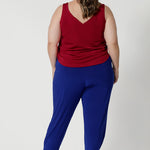 Plus sized model wears travel friendly pants that have soft stretch for added flexibility, ensuring they move comfortably with your body. The fabric's breathable qualities make them ideal for wearing year-round, keeping you cool and comfortable, even in warmer conditions. 