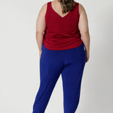 Plus sized model wears travel friendly pants that have soft stretch for added flexibility, ensuring they move comfortably with your body. The fabric's breathable qualities make them ideal for wearing year-round, keeping you cool and comfortable, even in warmer conditions. 