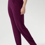 Indi Pants in Magenta available in size 8-24 in 2 lengths. Paired with black cami and cream caged sandal. 