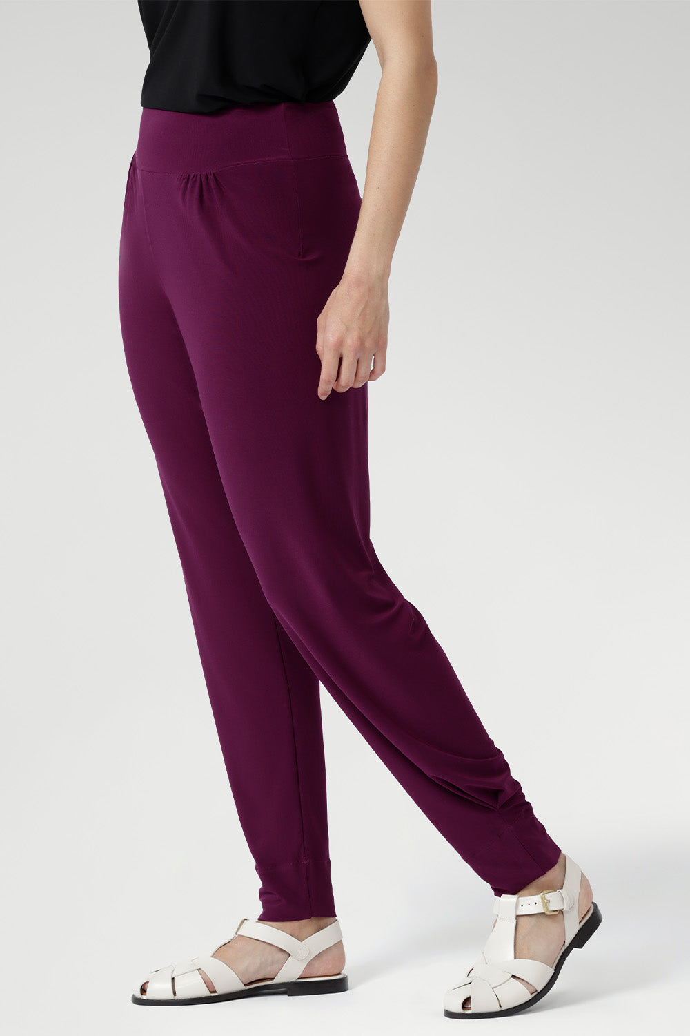 Indi Pants in Magenta available in size 8-24 in 2 lengths. Paired with black cami and cream caged sandal. 