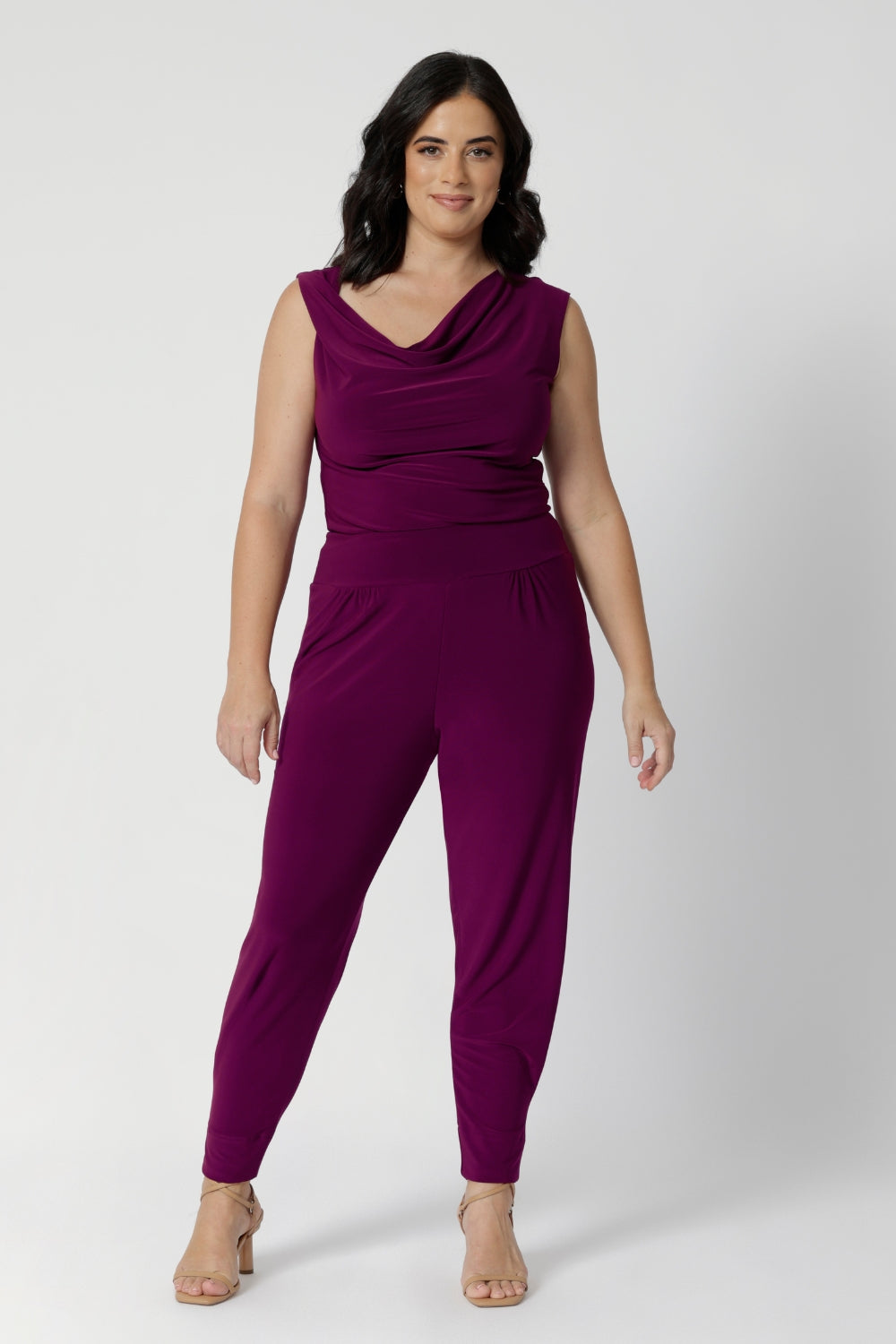 In a vibrant magenta hue, these pants effortlessly combine comfort with modern design, making them a go-to wardrobe staple you'll want in more than one pair. Petite height friendly pants are perfect for travel or casual styling. Model wears size 10.