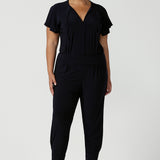 Great pants for travel, these dropped crotch, cropped leg, single seam navy pants are made stretchy jersey for ultimate comfort. Worn with white bamboo jersey top , shop these comfy navy pants for your travel and capsule wardrobe now!