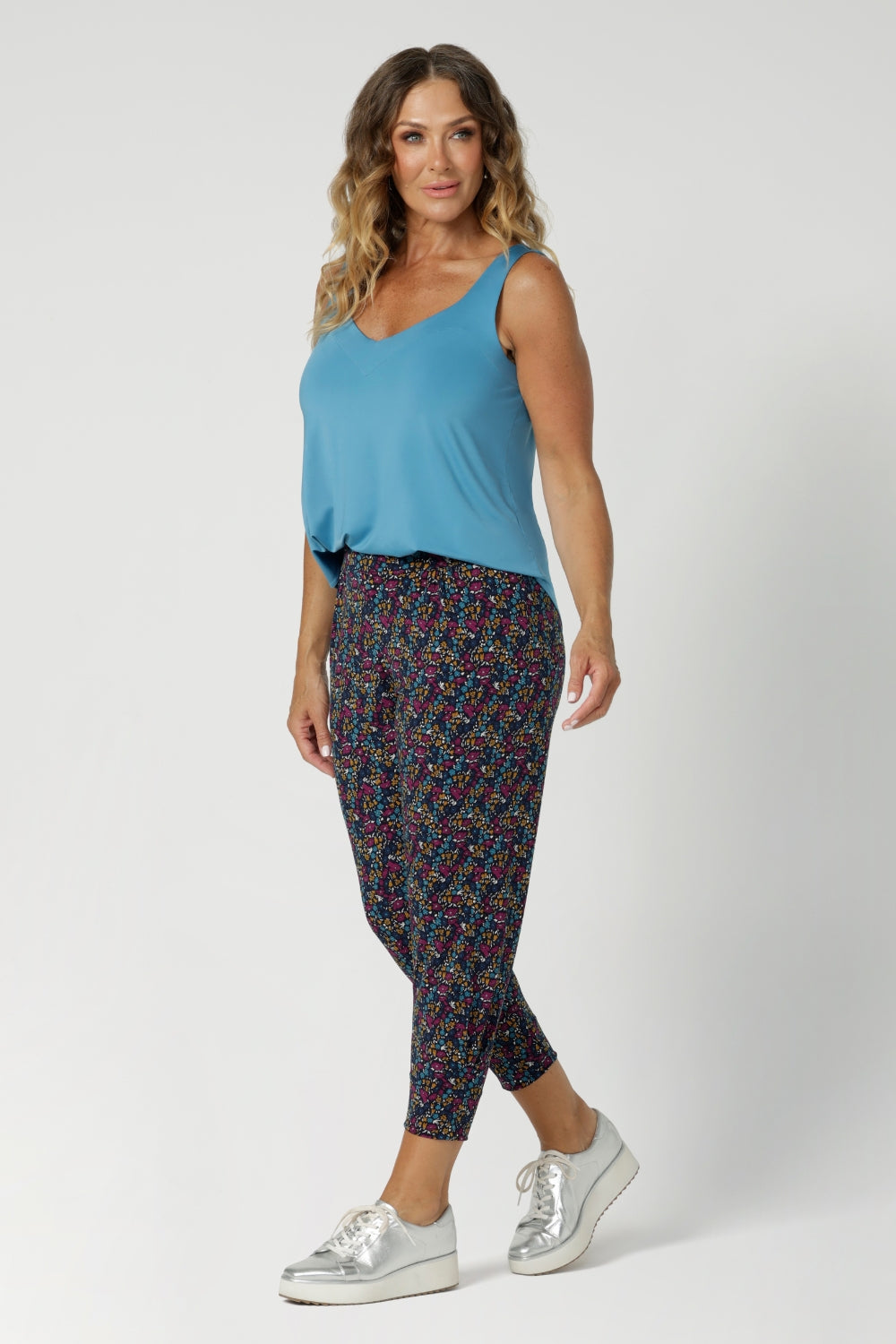 Size 12 woman wears comfortable pants with crotch ensures ease of movement, and the single inside seam legs offer a streamlined look. The mid-rise pull-on waist with a double-layer waistband provides support and comfort, while the front gathers add a touch of sophistication. Available in sizes 8-24.