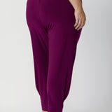 Close up image of Indi Pants in Magenta  featuring the single inside-seam leg that creates a sleek, streamlined effect, and the tapered leg complements the ankle cuffs. Easy care pants come in two different lengths to accommodate a variety of heights, available in sizes 8-24.