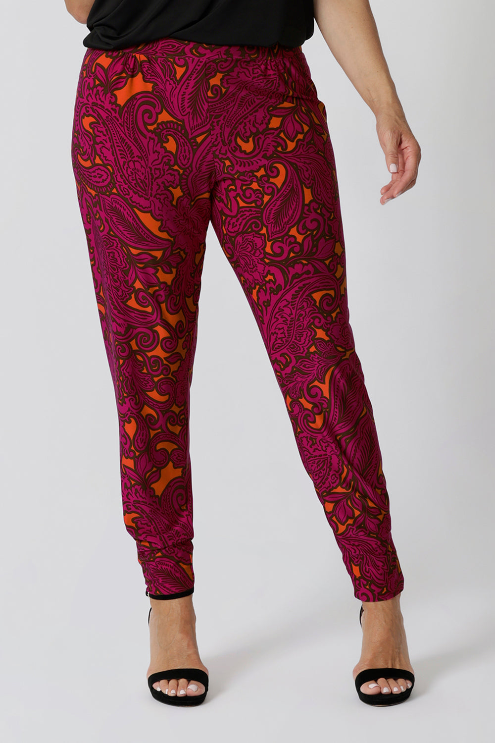 This summer-ready pant is designed for ultimate comfort and effortless style, making it the perfect choice for warm-weather days. Available in two heights, including this taller option, it ensures a flattering fit for all body types. Made from an easy-care fabric, it’s low-maintenance and perfect for travel or busy days on the go. The bold paisley print in vibrant tangerine and fuchsia adds a fun, eye-catching pop of colour, bringing an energetic touch to your summer wardrobe.