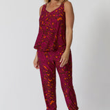 40 year old model wears paisley printed pant with matching paisley printed cami for a relaxed coord set. Practical and comfortable can be dressed up, worn casual or used for light exercise. 