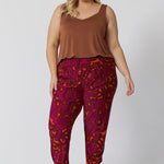 Plus sized model wears paisley printed travel pants. The relaxed, effortless fit offers plenty of room for movement, while the elegant print and comfortable fabric combine for a pant that’s as stylish as it is practical. Perfect for both casual outings and adventures, this pant will keep you looking and feeling cool all season long. Sizes 8-24 available