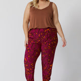 Plus sized model wears paisley printed travel pants. The relaxed, effortless fit offers plenty of room for movement, while the elegant print and comfortable fabric combine for a pant that’s as stylish as it is practical. Perfect for both casual outings and adventures, this pant will keep you looking and feeling cool all season long. Sizes 8-24 available