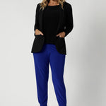 Proudly Australian made, these pants from Leina & Fleur are tailored specifically for comfort and style, with women of all sizes and shapes in mind. They offer a flattering, flexible fit that’s perfect for work wear styling. Their vibrant cobalt colour is featured in this image worn by size 12 model with black corporate blazer & top to create a classic yet bold look.