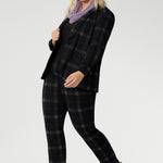 Infinity Knit Scarf adds timeless elegance to any outfit. For a coordinated, polished look, style it with the matching Zara Top in the same fabric. Easy care easy wear combination for warmth, comfort, and elevated day-to-day dressing. Size 18 woman wears her Lilac Winter Scarf with Plaid Suit.
