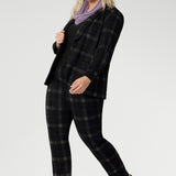 Infinity Knit Scarf adds timeless elegance to any outfit. For a coordinated, polished look, style it with the matching Zara Top in the same fabric. Easy care easy wear combination for warmth, comfort, and elevated day-to-day dressing. Size 18 woman wears her Lilac Winter Scarf with Plaid Suit.