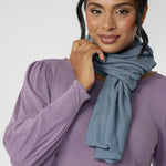 Crafted from a soft Tencel wool blend, each scarf features a luxe double-layer construction in a closed-loop design that drapes beautifully, whether worn long and relaxed or styled with a cozy double wrap around the neck. Longe scarf can be easily styled in countless ways for endless styling.