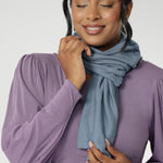The Infinity Knit Scarf collection is designed for women who love warmth, elegance, and versatility through the colder months. Crafted from a soft Tencel wool blend, each scarf features a luxe double-layer construction in a closed-loop design that drapes beautifully, whether worn long and relaxed or styled with a cozy double wrap around the neck.