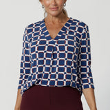 The Jaime Top is the perfect addition to your workwear wardrobe, offering effortless style and versatility that seamlessly transitions from office wear to weekend casual. Crafted from a luxurious deep blue dry-touch jersey fabric, this top offers a soft stretch that provides all-day comfort while maintaining a polished, structured look. 