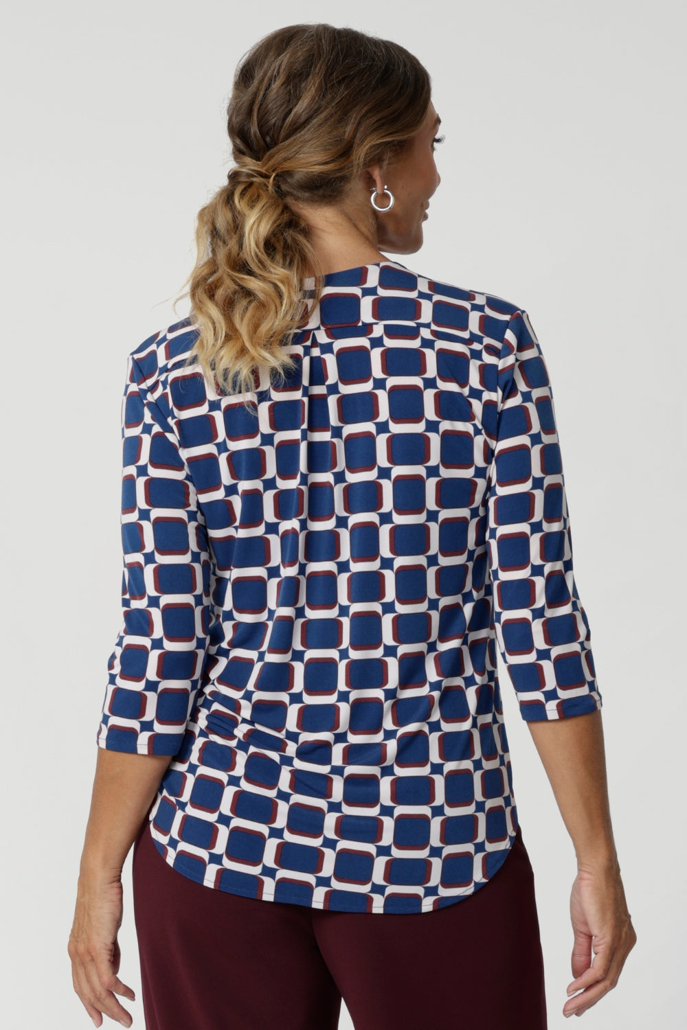 The high-quality fabric ensures a sleek drape, making it an ideal choice for women who want to look stylish and feel at ease throughout the day. Workwear shirt has a geometric design that has print details in blue, white and espresso.