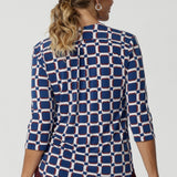 The high-quality fabric ensures a sleek drape, making it an ideal choice for women who want to look stylish and feel at ease throughout the day. Workwear shirt has a geometric design that has print details in blue, white and espresso.