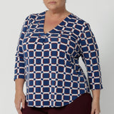 The V-neckline is complemented by a tailored tuck at the centre front, adding a modern and refined touch to this collarless shirt. The 3/4 length sleeves offer the perfect balance of coverage and breathability, making it suitable for both cooler and warmer months. A shoulder yoke with a centre-back tailored tuck adds an extra dimension to the top, creating a flattering and sophisticated fit.