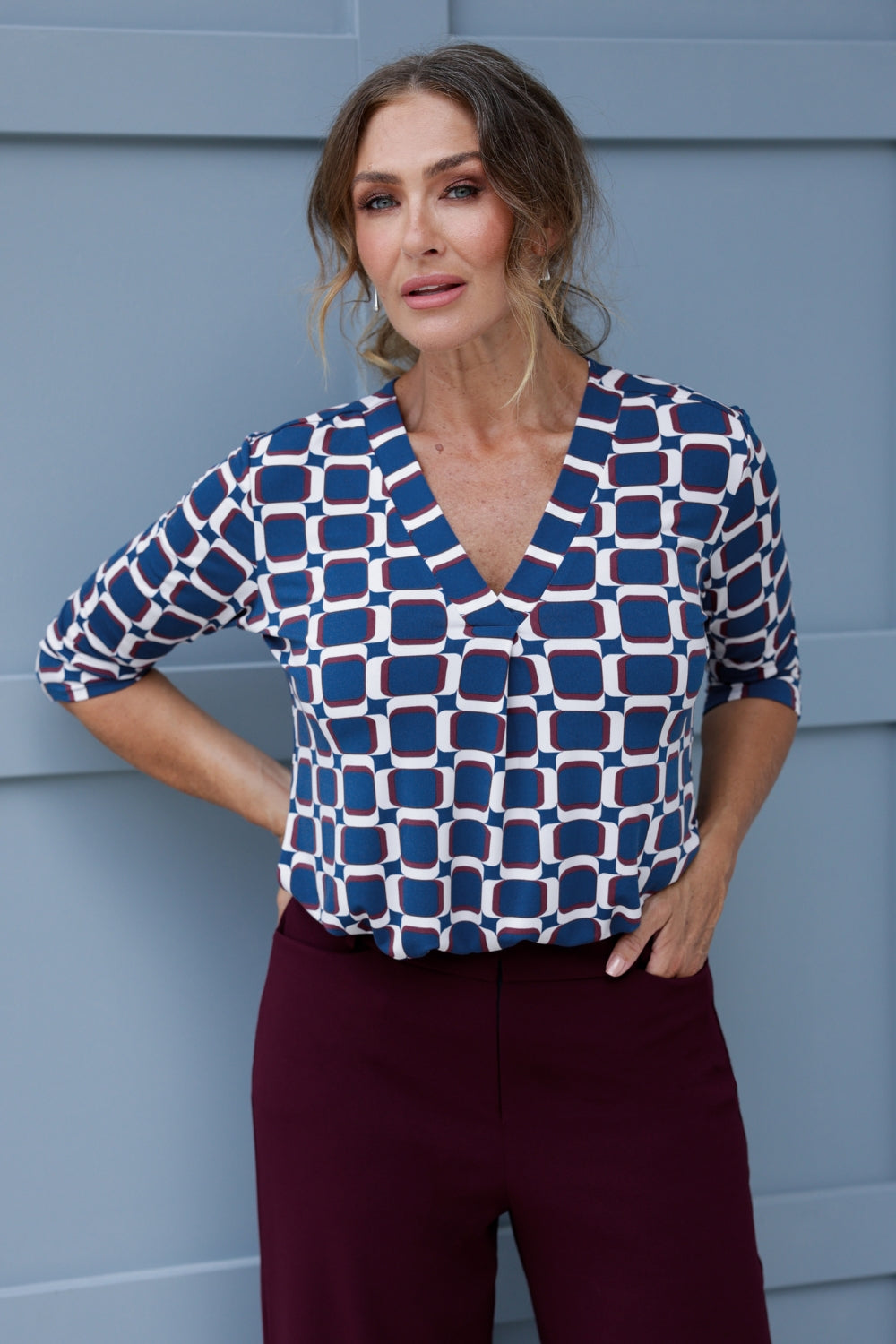 The V-neckline is complemented by a tailored tuck at the centre front, adding a modern and refined touch to this collarless shirt. The 3/4 length sleeves offer the perfect balance of coverage and breathability, making it suitable for both cooler and warmer months. 