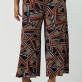 Front view of close up of a size 16 woman wears the Dany Culotte in Trixie, a printed Jersey work pant with a geometric pattern. Wide leg with functional pockets and wide waistband. Cropped length and petite height friendly. Made in Australia for women size 8 - 24.