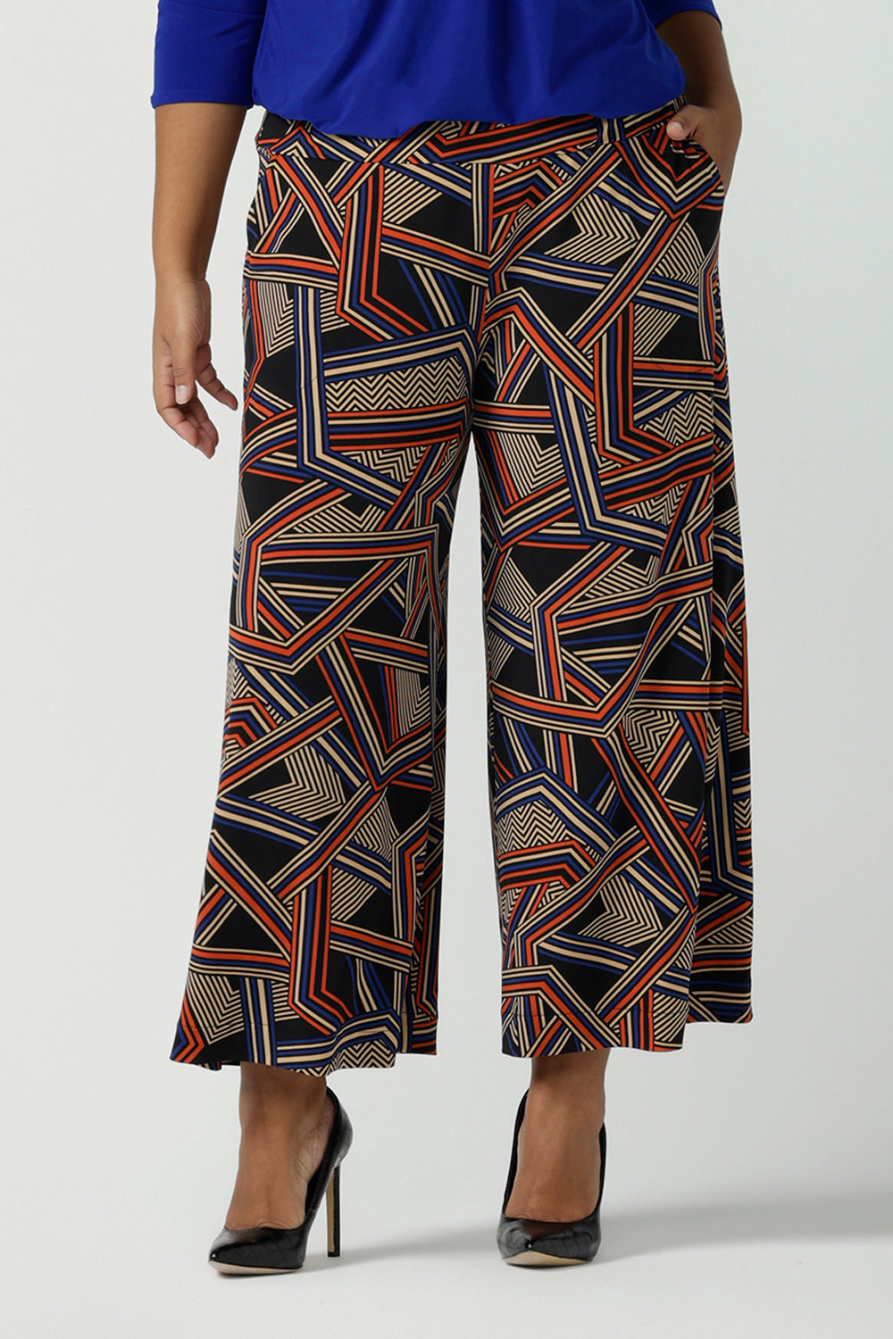 Front view of close up of a size 16 woman wears the Dany Culotte in Trixie, a printed Jersey work pant with a geometric pattern. Wide leg with functional pockets and wide waistband. Cropped length and petite height friendly. Made in Australia for women size 8 - 24.