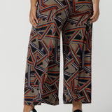 Close up of a size 16 woman wears the Dany Culotte in Trixie, a printed Jersey work pant with a geometric pattern. Wide leg with functional pockets and wide waistband. Cropped length and petite height friendly. Made in Australia for women size 8 - 24.