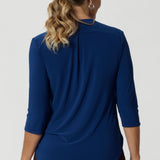 A shoulder yoke with a centre-back tailored tuck adds an extra dimension to the top, creating a flattering and sophisticated fit. The curved shirttail hemline enhances the overall shape of the top, providing a flattering silhouette that pairs beautifully with high-waisted pants, skirts, or tucked into your favourite trousers