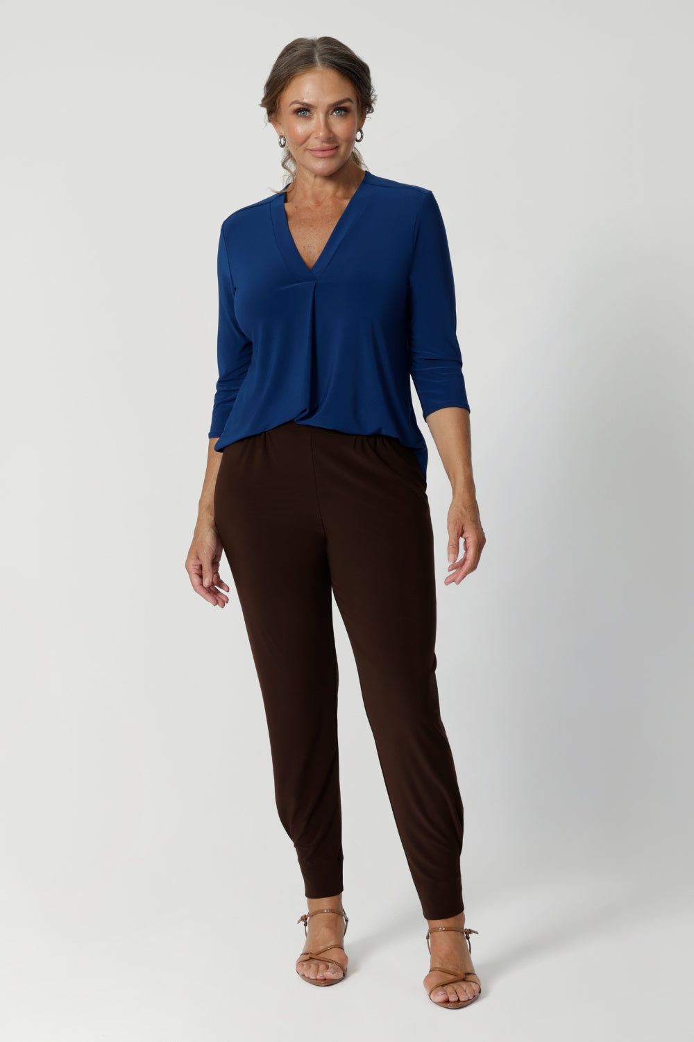 The curved shirttail hemline enhances the overall shape of the top, providing a flattering silhouette that pairs beautifully with high-waisted pants, skirts, or tucked into your favourite trousers. Available in sizes 8-24, the Jaime Top is perfect for mixing and matching with other pieces from our Australian-made women's fashion collection.