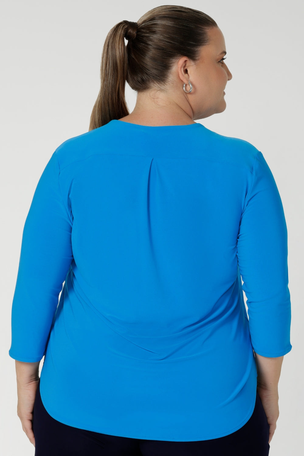 Perfect for the woman on the go, the Jaime Top offers an easy yet tailored look that seamlessly transitions from work to after-hours. Whether paired with skirts, pants, or layered with a jacket, this top delivers effortless style and comfort, making it a must-have for any busy professional’s wardrobe.