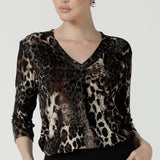 A size 10 woman wears the Jaime Top in Panthera, a jersey animal print top perfect for work to weekend. A v-neck top with 3/4 sleeves. Made in Australia for petite to plus size women size 8 - 24. 