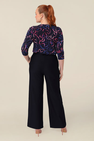 Back view of well-fitting workwear pants, these wide leg, tailored trousers in Navy are shown in a size 12 and are styled for easy office wear. Australian made by Australian and New Zealand women's pants experts,L&F, these easy-care pants are comfortable for work and corporate wear.