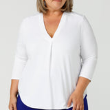 A good white top for your capsule wardrobe, this V-neck , 3/4 sleeve top is made in luxurious white bamboo jersey. Shown on a size 18, plus size woman, this classic top makes a great work blouse. Australian made women's clothing brand, Leina & Fleur, makes white bamboo jersey tops like this and more in inclusive sizes, 8 to 24 for petite to plus size women - shop now in their online fashion boutique!