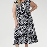 The double-layered bodice with bust darts provides a flattering shape, while the round neckline and soft-stretch fabric ensure a comfortable fit that moves with you throughout the day. Thoughtful design details such as the side pockets and fully lined skirt elevate the dress from simple to sophisticated, making it both practical and polished.