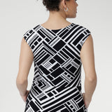 The double-layered bodice with bust darts provides a flattering shape, while the round neckline and soft-stretch fabric ensure a comfortable fit that moves with you throughout the day. Thoughtful design details such as the side pockets and fully lined skirt elevate the dress from simple to sophisticated, making it both practical and polished.