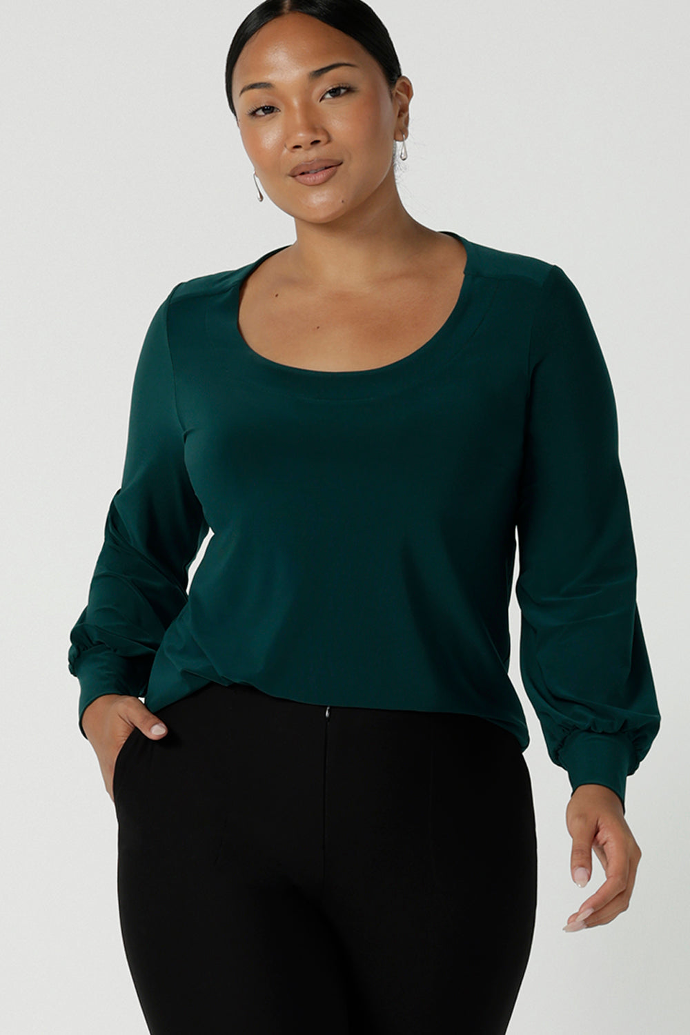 Size 10 woman wears the Jasper top in Aline. A work friendly style and made in Australia for women. Size 8 - 24.