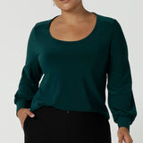 Size 10 woman wears the Jasper top in Aline. A work friendly style and made in Australia for women. Size 8 - 24.