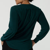 Back view of a size 10 woman wears the Jasper top in Aline. A work friendly style and made in Australia for women. Size 8 - 24.