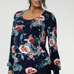 Crafted from a premium dry-touch jersey with soft stretch, the Vintage Rose print blooms across a deep navy base, with floral accents in pink, red, and blue. Designed and made in Australia for women in sizes 8 to 24, the Jasper Top brings together comfort, colour, and timeless style.