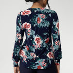 This semi-fitted silhouette features a soft scoop neckline with clean facing detail, bust darts for subtle shaping, and full-length bishop sleeves finished with a cuff that can be styled to suit your look. A classic shoulder yoke with gentle gathers at the centre back adds to the top’s fluid drape, while the shirttail hemline offers a flattering finish that looks beautiful tucked or worn loose.