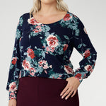 Crafted from a premium, dry-touch jersey fabric with a soft stretch, it features a beautiful Vintage Rose print set against a navy base, adorned with delicate floral accents in pink, red, and blue. Proudly Australian made and available in inclusive sizing from 8 to 24, the Jasper Top is the perfect blend of comfort, colour, and classic style