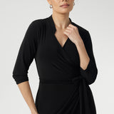 Women's wrap dress, tailored for a corporate or event setting and featuring a modern angular collar detail adds an edgy look to your work wear style. Sizes 8-24 and Proudly Made in Australia.