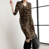 Size 10 woman wears the Jett Dress in Gold Leopard. A functioning wrap dress with a tie waist and mandarin collar. Trending Leopard print. Made in Australia for women size 8 - 24. Petite to plus size fashion. 