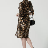 Back view of of a size 10 woman wears the Jett Dress in Gold Leopard. A functioning wrap dress with a tie waist and mandarin collar. Trending Leopard print. Made in Australia for women size 8 - 24. Petite to plus size fashion.